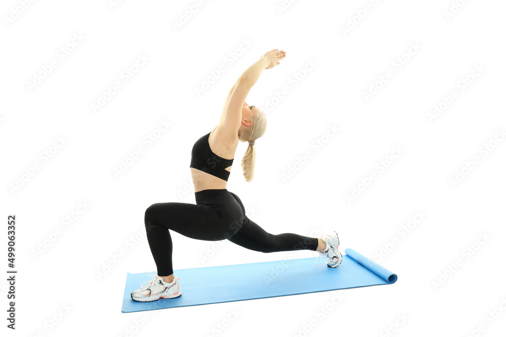 Sporty woman doing exercise on fitness mat, isolated on white background Sporty woman doing exercise on fitness mat, isolated on white background
