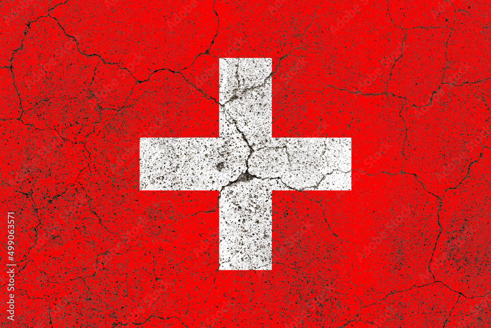 Switzerland flag on a cracked old concrete wall surface Switzerland flag on a cracked old concrete wall surface