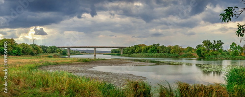 Принти на полотні Dark rain clouds over the Southern Bug river