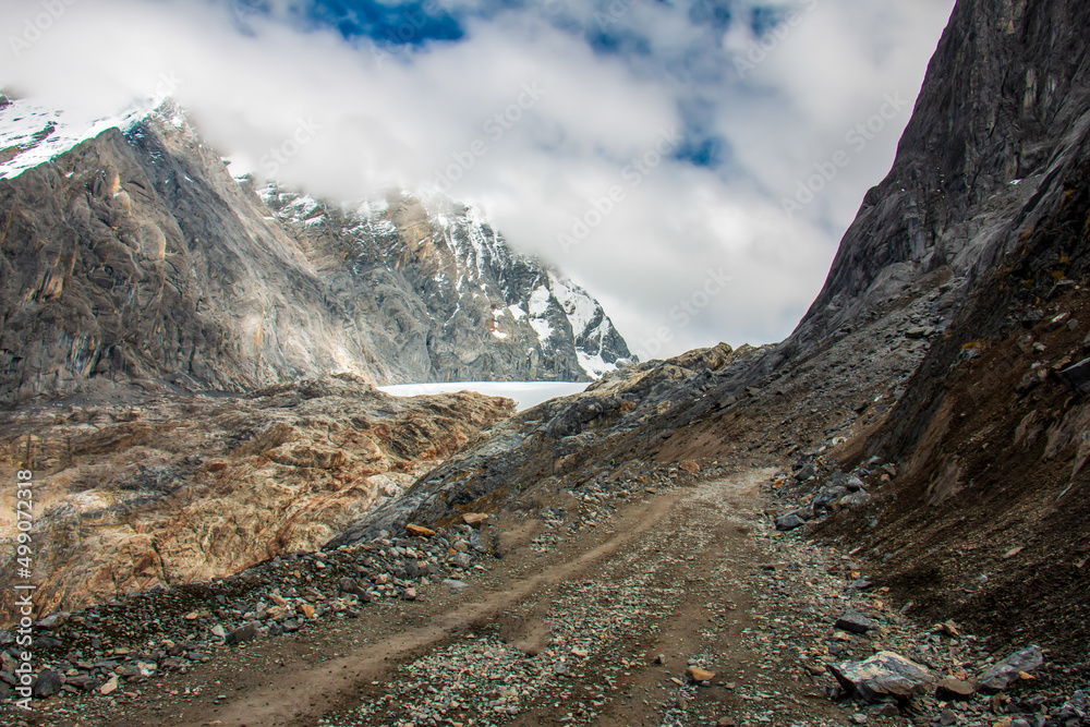 Road to snowy Raura in Oyon - Peru. A snowy peak.