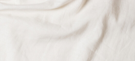 White crumpled linen fabric texture background. Natural linen organic eco textiles canvas background. Top view