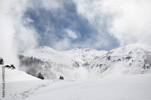 Landscape of beautiful snow Mountain and river at cloudy sky