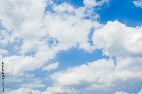 Sunny day abstract cloud and blue sky background texture.
