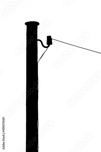 Black silhouette of old telephone pole with white background.