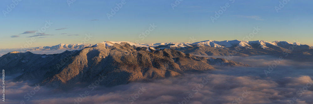 Winter panorama of Ciucas, Piatra Mare and Baiului mountains.