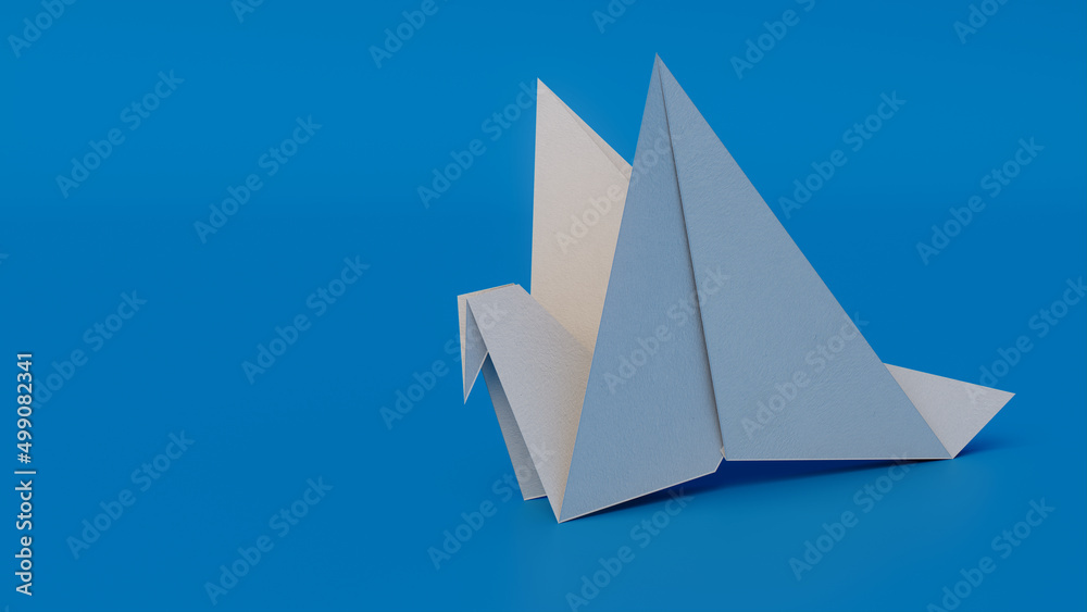 Bird made from folded White paper against Blue background. Origami concept with Copy Space.
