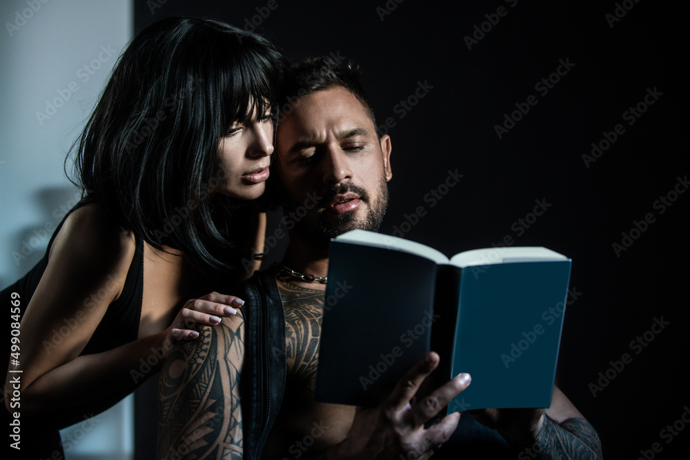 Sexy couple reading book. Romantic lovely coupl in love, sexy boyfriend and beautiful girlfriend. Romantic lovers. Sexy couple reading book. Romantic lovely coupl in love, sexy boyfriend and beautiful girlfriend. Romantic lovers.