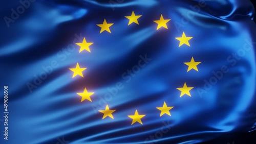 Waving European flag close-up on a dark background in slow motion.