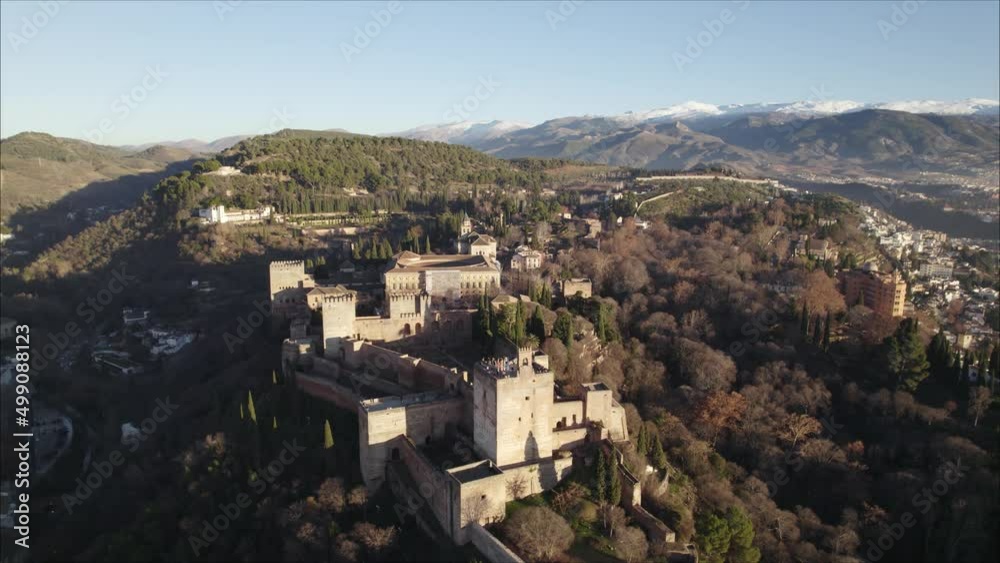 The Alhambra Fortress on Forested Hilltop, Pullback revealing majestic landscape. Spain The Alhambra Fortress on Forested Hilltop, Pullback revealing majestic landscape. Spain