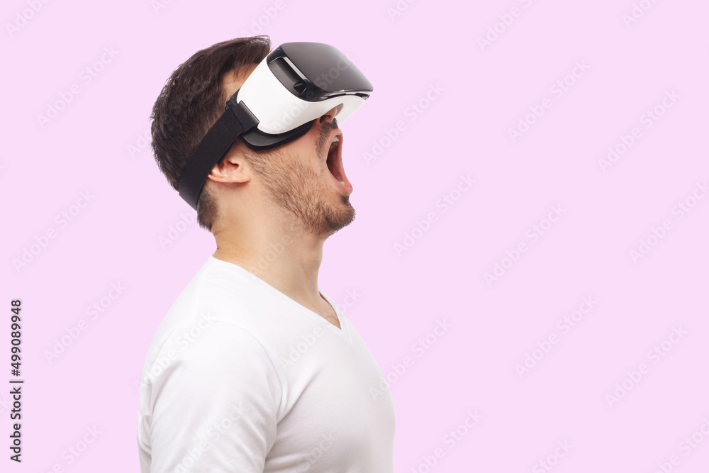 Banner of screaming young man in virtual reality VR glasses Banner of screaming young man in virtual reality VR glasses