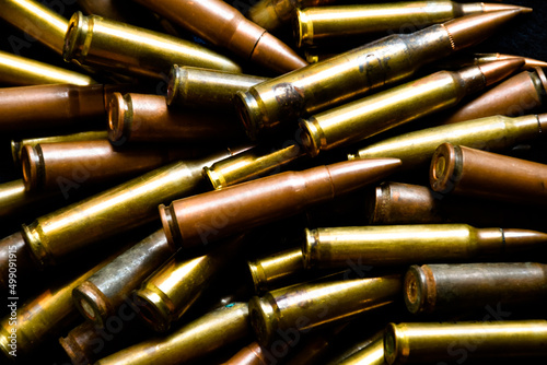 Ammo, ammunition on dark background, top view, soft and selective focus.