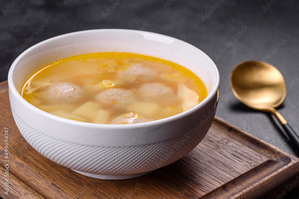 Soup with turkey meatballs, potatoes and vegetables. Selective focus Soup with turkey meatballs, potatoes and vegetables. Selective focus