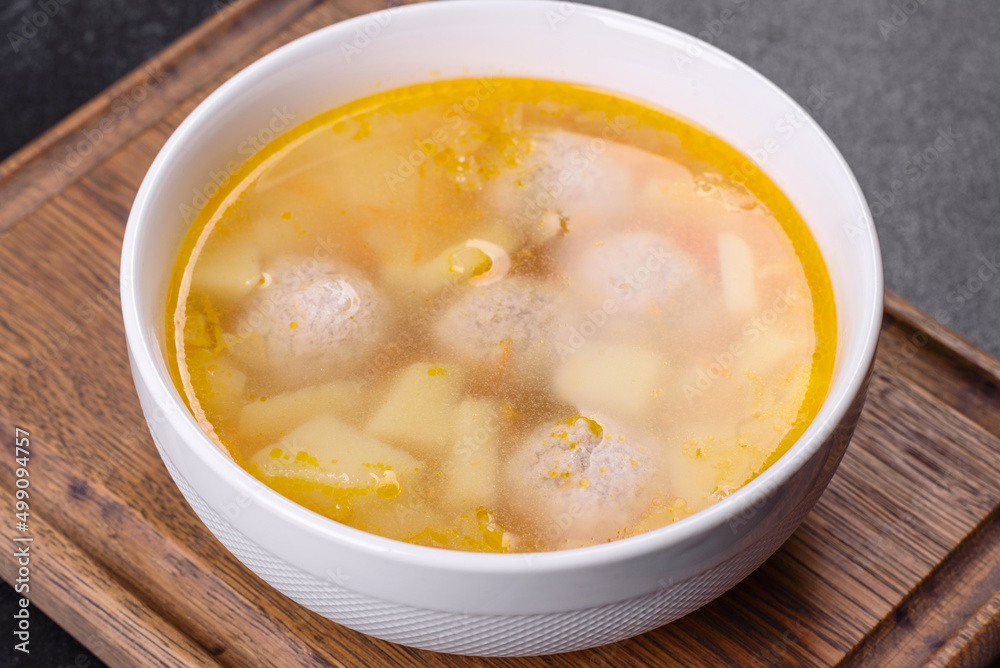Soup with turkey meatballs, potatoes and vegetables. Selective focus Soup with turkey meatballs, potatoes and vegetables. Selective focus