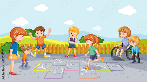 Happy children playing hopscotch on playground