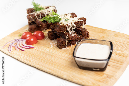 croutons, wooden board, white background