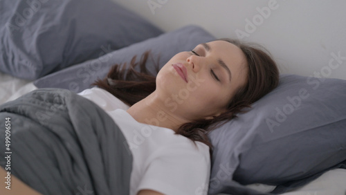 Woman Sleeping in Bed Peacefully 