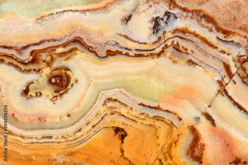The texture of the stone. The surface of the semi-precious mineral Onyx. Spots of white and cream color The texture of the stone. The surface of the semi-precious mineral Onyx. Spots of white and cream color
