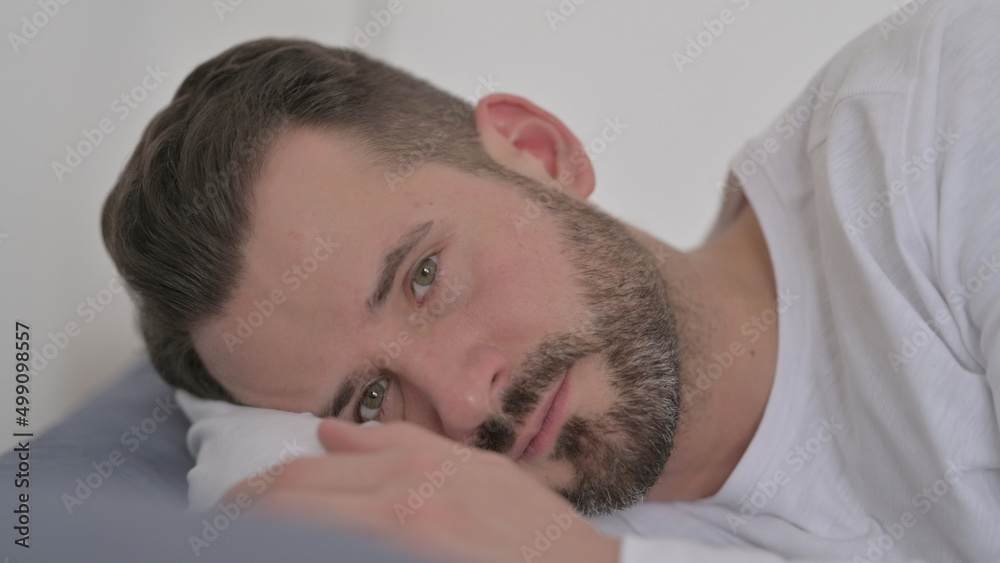 Man Awake in Bed Thinking Man Awake in Bed Thinking