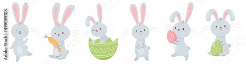 Vector set illustration for easter holiday. Cute hares are holding carrots and Easter eggs. Easter Bunnies.