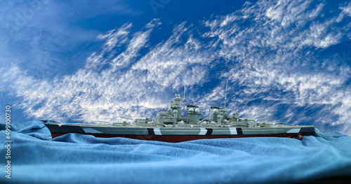 Fotografiet Assemble of  German warship plastic model with  clouds sky background ,hobby,German battleship H-class Hutten in 1940 which was 277