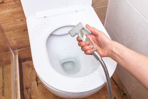 Εκτύπωση καμβά close-up, in a female hand a hygienic shower, against the background of a modern