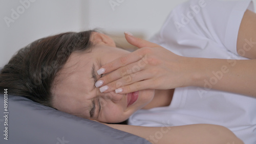 Woman Crying while Sleeping in Bed