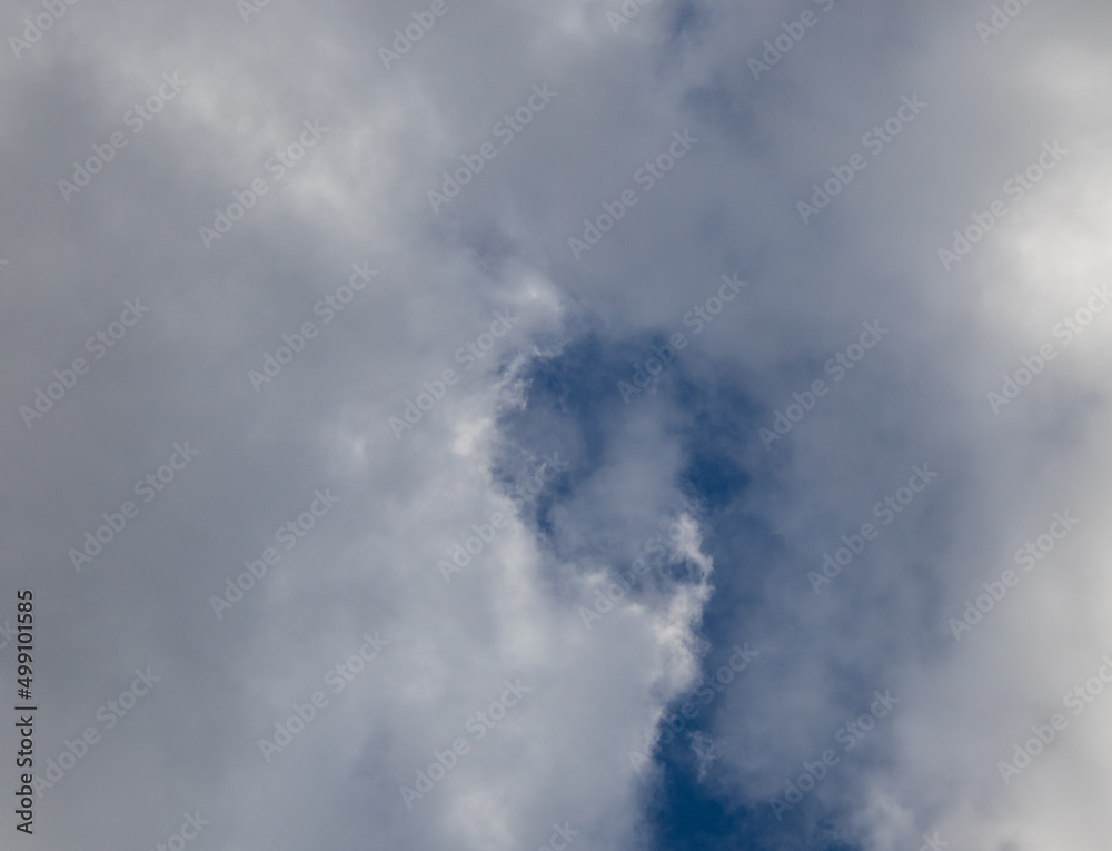 Cloudscape with shapes and faces image for background use