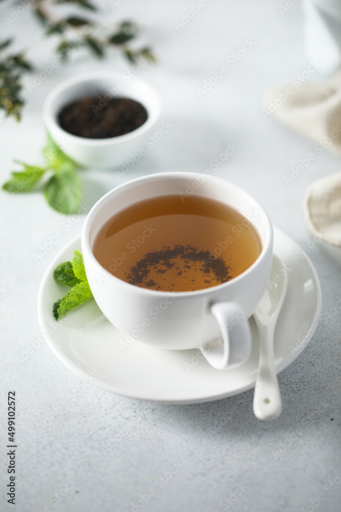 Healthy homemade mint tea in a white cup Healthy homemade mint tea in a white cup