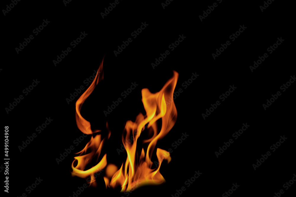 Close up burning flames on black background for graphic design or wallpaper Close up burning flames on black background for graphic design or wallpaper