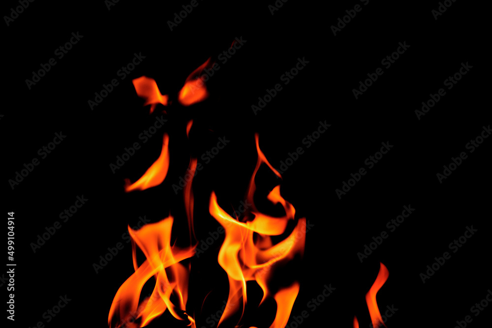 Close up burning flames on black background for graphic design or wallpaper Close up burning flames on black background for graphic design or wallpaper