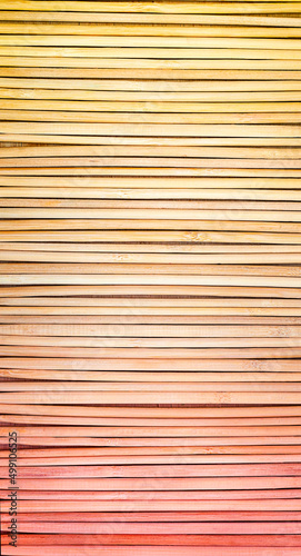 vertical pink background of bamboo sticks