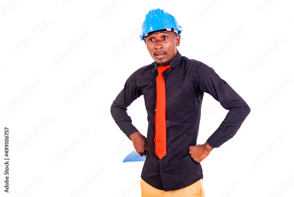 young man engineer holding his hands on his hips. young man engineer holding his hands on his hips.