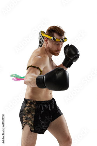 Portrait of professional thai boxer practicing isolated on white studio background. Sport, muay thai, competition, fight club concept © master1305