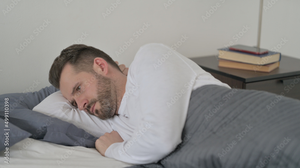 Man Unable to Sleep in Bed