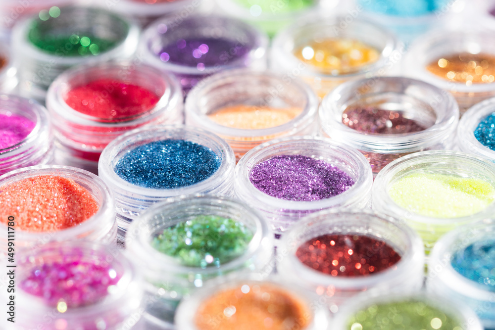jars with colored sequins lie in rows jars with colored sequins lie in rows