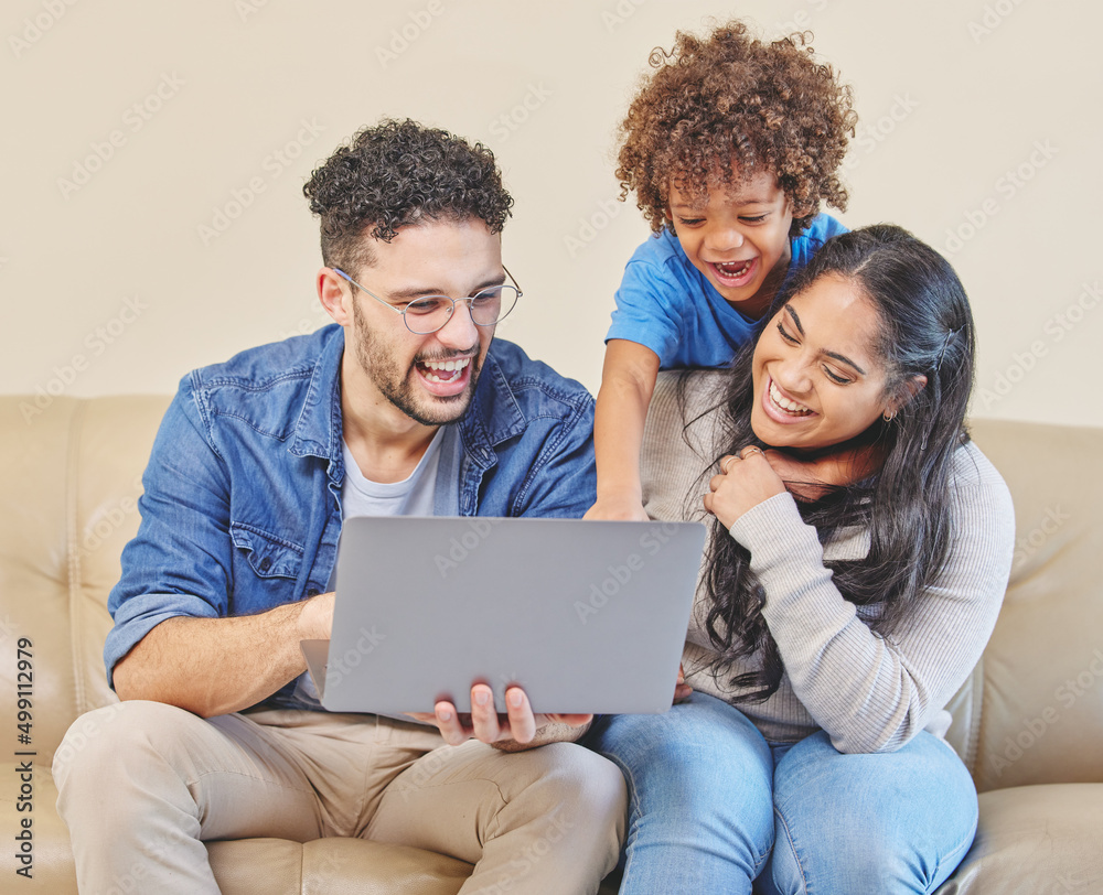 Teach them young and theyll change the world. Shot of a young family using a laptop together. Teach them young and theyll change the world. Shot of a young family using a laptop together.