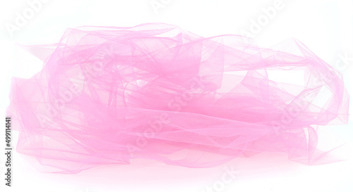 Abstract pink tulle fabric isolated on white background. Bright transparent material curve wave on white. photo