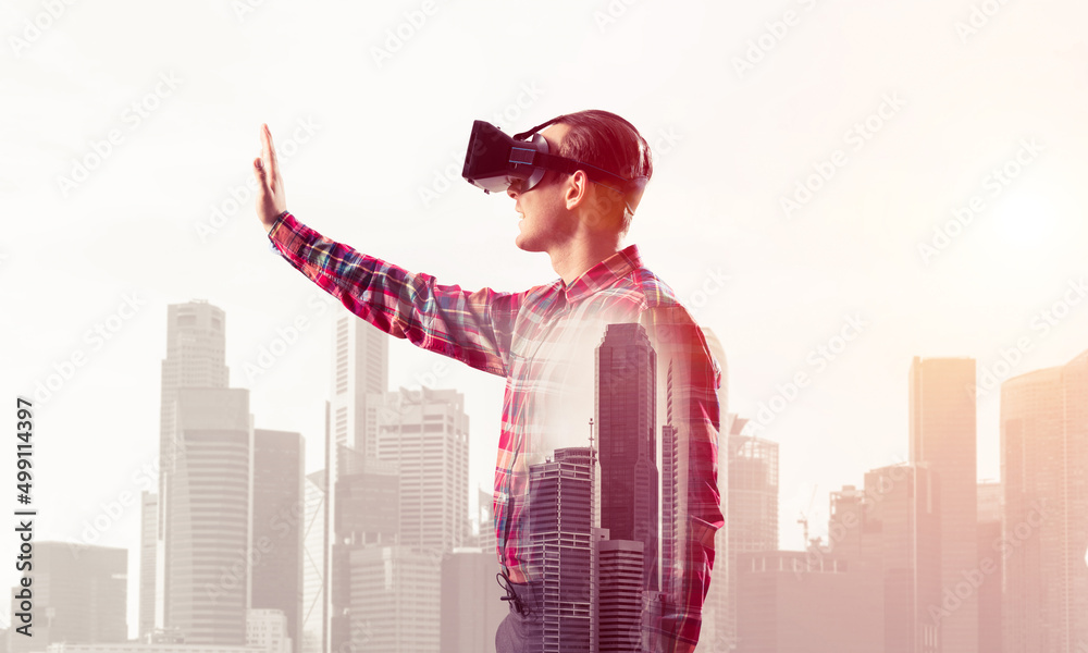 Guy wearing checked shirt and virtual mask stretching hand to touch something Guy wearing checked shirt and virtual mask stretching hand to touch something
