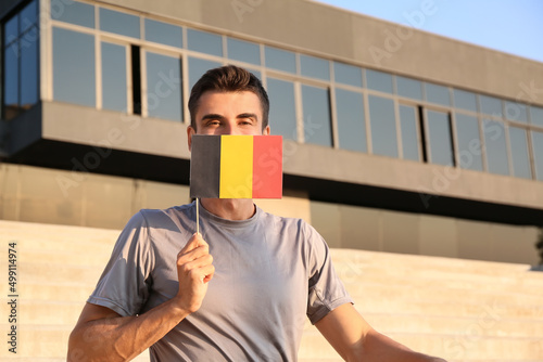 Young man with flag of Belg...
