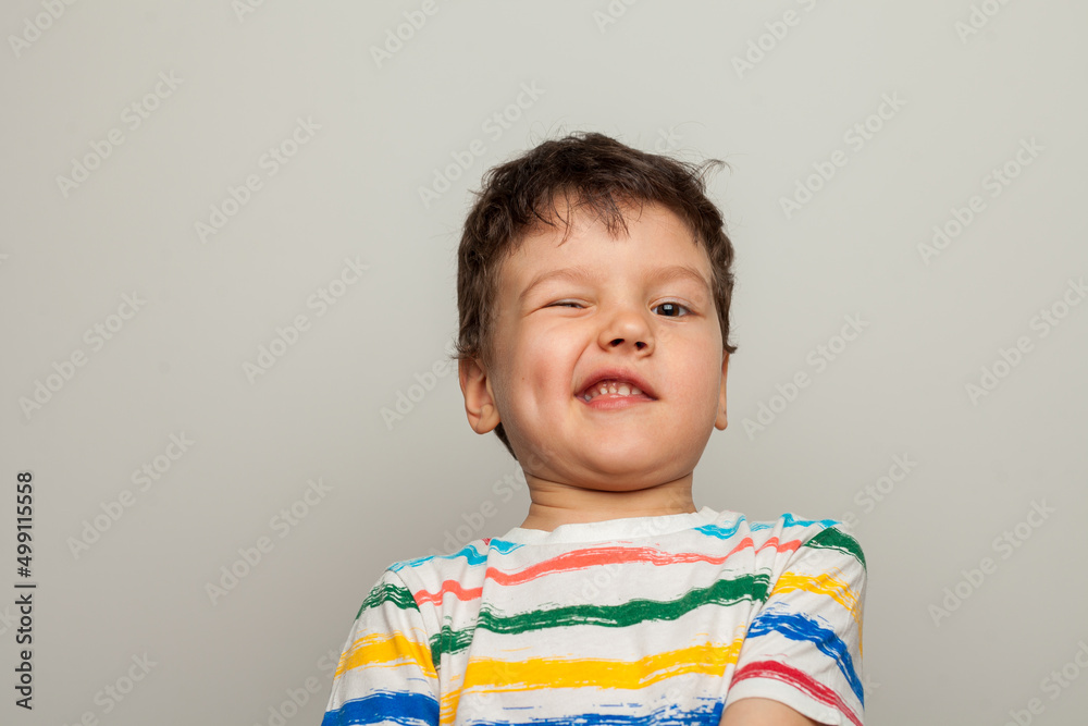 Beautiful kid boy wearing casual t-shirt standing over isolated white background disgusted expression Beautiful kid boy wearing casual t-shirt standing over isolated white background disgusted expression