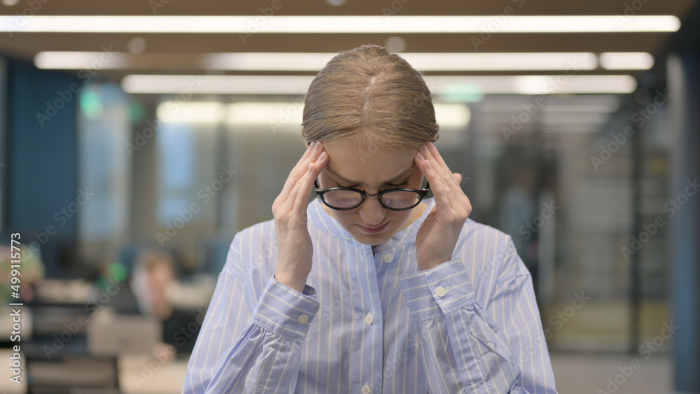 Fototapeta premium Portrait of Young Woman having Headache