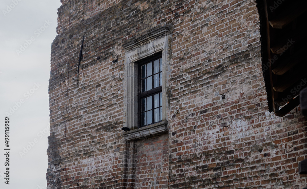 An old window of castle with white bricks
