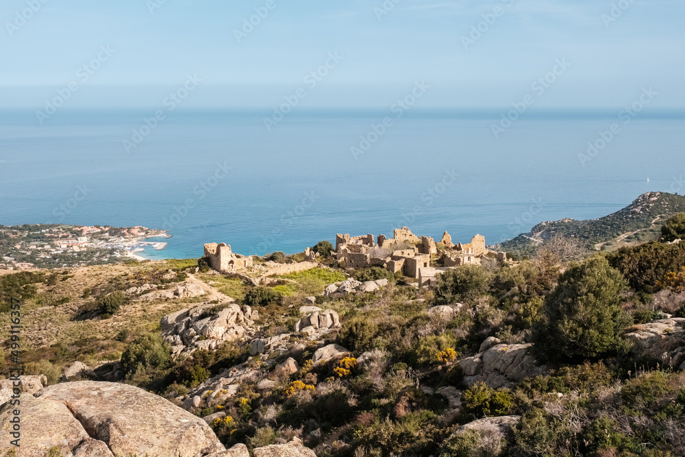 The abandoned village of Occi near Lumio in the Balagne region of Corsica with Mediterranean sea in the distance