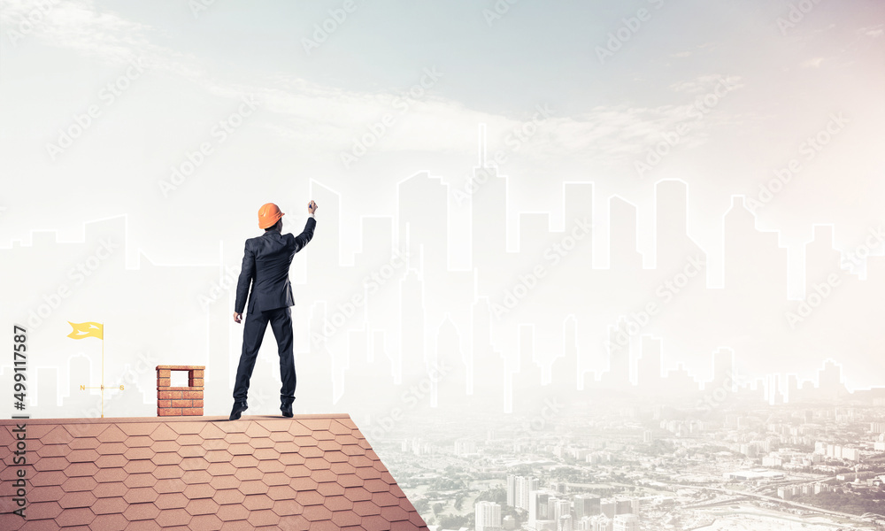 Man architect draw silhouette of modern city on blue sky. Mixed Man architect draw silhouette of modern city on blue sky. Mixed