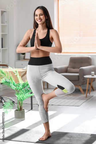 Young barefoot woman medita...