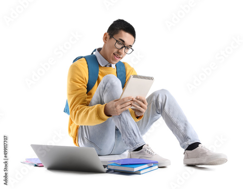 Male Asian student with not...