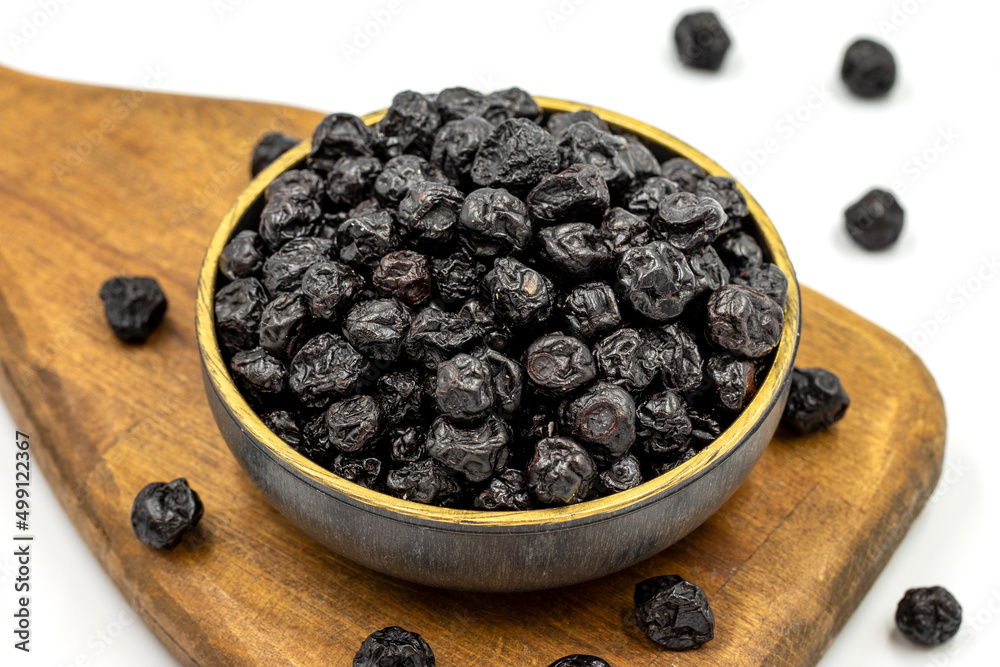 Dried blueberries isolated on a white background. Bulk blueberries. close up. Copy space. Space for text Dried blueberries isolated on a white background. Bulk blueberries. close up. Copy space. Space for text