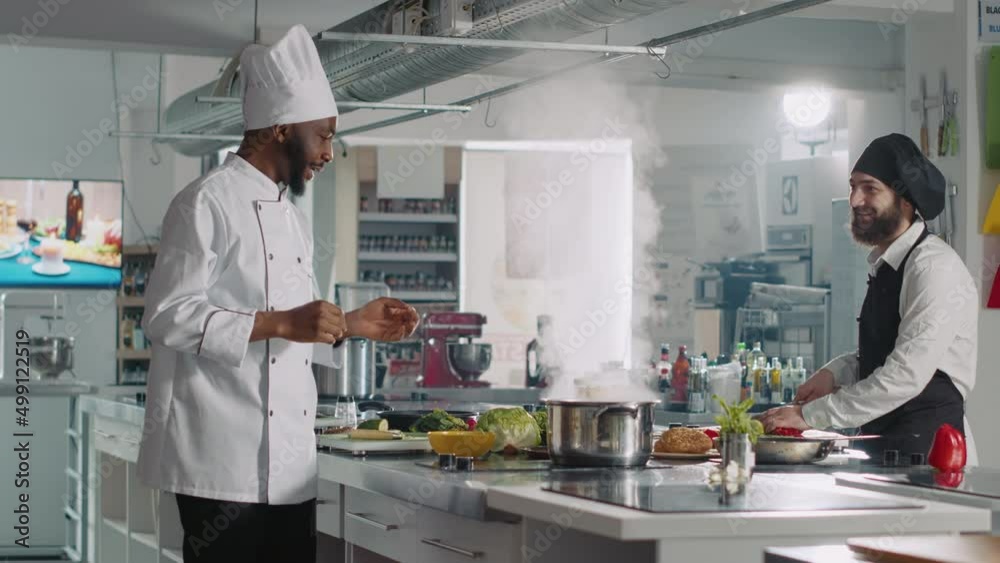 POV of professional chefs hosting cooking show on TV program, filming online gastronomy class on camera and preparing delicious food dish. Men using ingredients and utensils to cook. POV of professional chefs hosting cooking show on TV program, filming online gastronomy class on camera and preparing delicious food dish. Men using ingredients and utensils to cook.