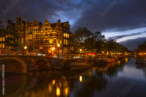 Embankment of the Amsterdam Canal on a Cloudy Evening