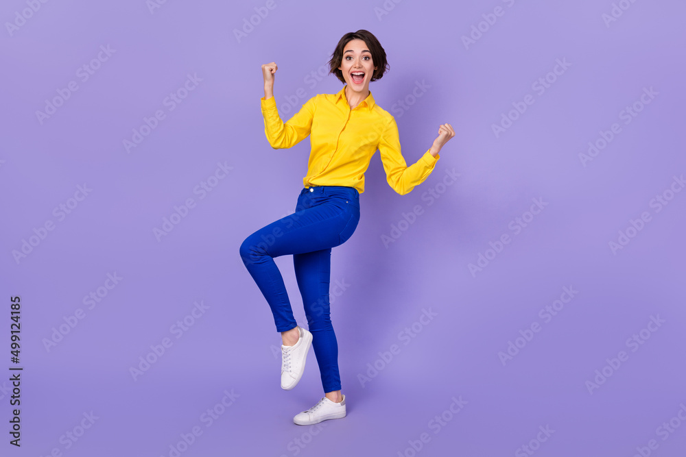 Full size photo of hooray millennial brunette lady yell wear shirt trousers sneakers isolated on purple color background